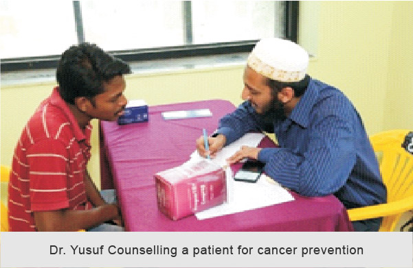 Dr Yusuf Mistry counselling about oral cancer